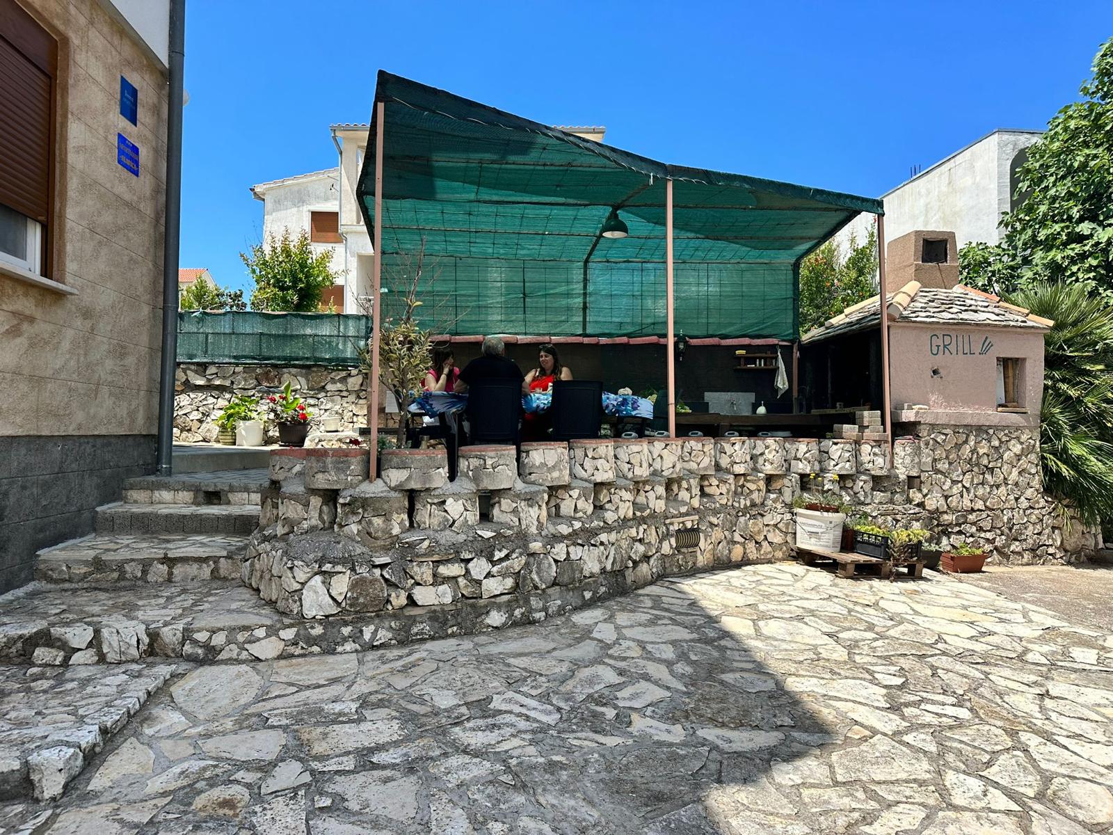 Stone barbecue terrace in the garden
